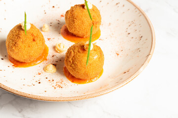 Tasty arancini typical dish of the region of Sicily in Italy. Italian food from the south of the country. Copy space. High quality photo