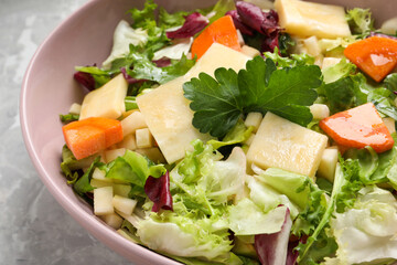 Delicious turnip salad served on light grey marble table, closeup