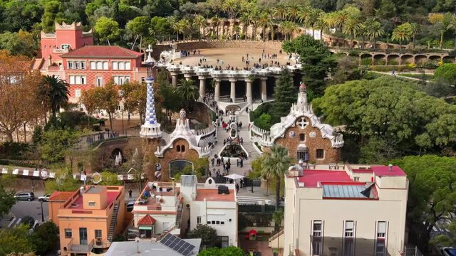 Aerial drone view of Barcelona, Spain. Park Guell with tourists, a lot of greenery