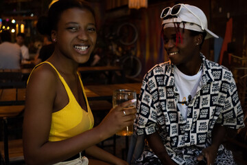 Young afro couple in a nightclub.