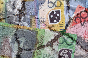 A picture of the Australian dollar on the cracked asphalt