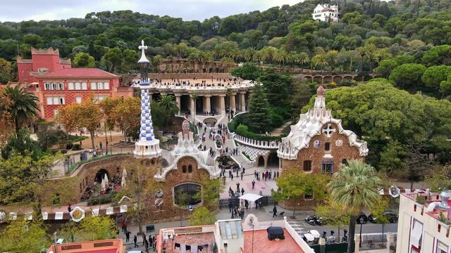 Aerial drone view of Barcelona, Spain. Park Guell with tourists, a lot of greenery