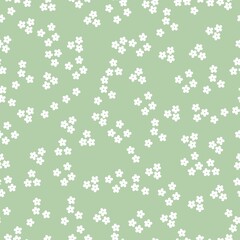 Vintage pattern. Small white flowers . pale green background. Seamless vector template for design and fashion prints.