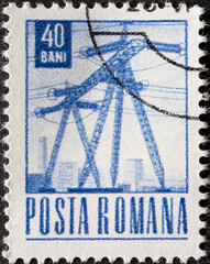 Romania - circa 1969: A post stamp printed in Romania showing a power pylon