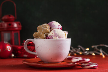 Candy Cane Ice Cream scoops  in cup and Christmas decor. New Year's desserts