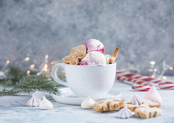 Candy Cane Ice Cream scoops  in cup and Christmas decor. New Year's desserts