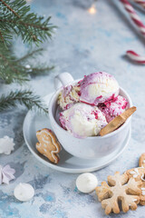 Candy Cane Ice Cream scoops  in cup and Christmas decor. New Year's desserts