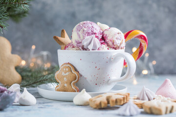 Candy Cane Ice Cream scoops  in cup and Christmas decor. New Year's desserts