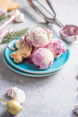 Candy Cane Ice Cream scoops  in plate and Christmas decor. New Year's desserts