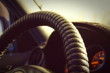 steering wheel inside the car with bokeh effect
