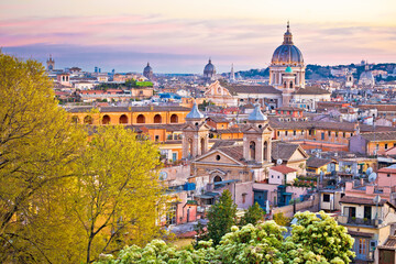 Rome. Colorful dusk view of Rome rooftops and landmarks