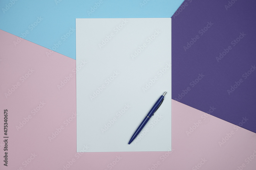 Poster empty paper and pen on colored paper background with copy space