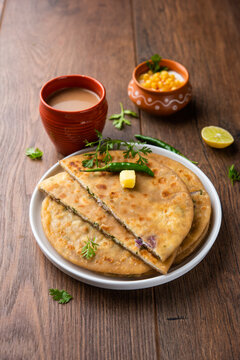 Paneer paratha is a popular North Indian flatbread made with whole wheat flour dough and stuffed with savory, spiced, grated paneer
