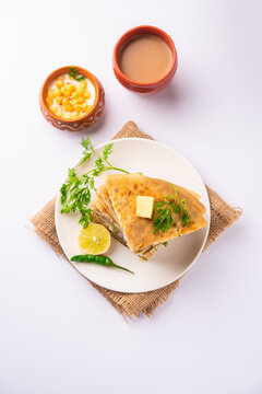 Paneer paratha is a popular North Indian flatbread made with whole wheat flour dough and stuffed with savory, spiced, grated paneer