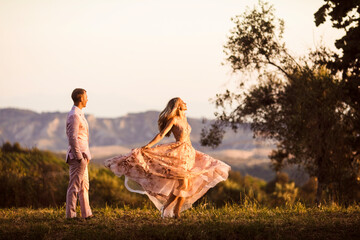 the man watches his beloved dancing at dawn