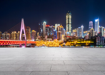 Fototapeta na wymiar cityscape and skyline of downtown near water of chongqing at night