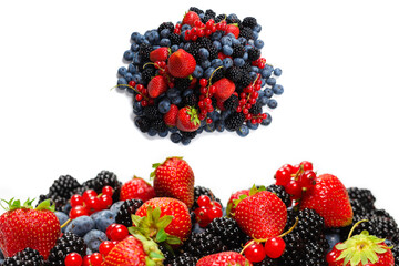 Blackberry, raspberry, blueberry,  red currant and mint background.