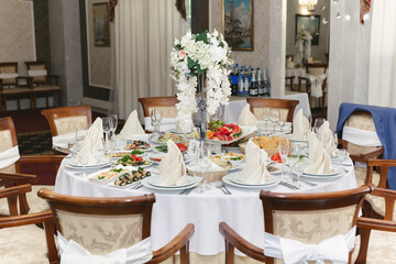 Served wedding banquet table with dishes in the restaurant