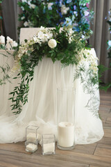Beautiful wedding decor: flowers and candles.