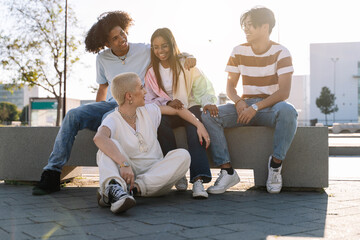 Group of happy teenager diverse friends hanging out and having fun together