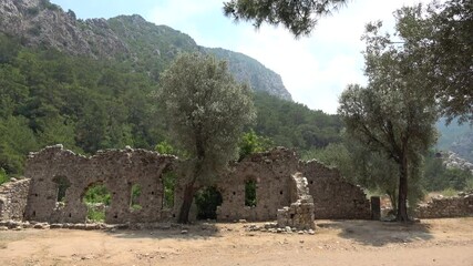 Olimpos, Antalya, Turkey - 29th of May 2021: 4K Ruins of ancient city of Olimpos inside of forest
