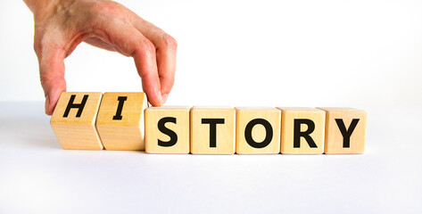 Story and history symbol. Historic turns a cube, changes the word story to history. Beautiful white table, white background. Business, historical and story or history concept. Copy space.