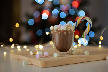 Obraz na płótnie Canvas Cup of hot chocolate with marshmallows with bokeh lights on background