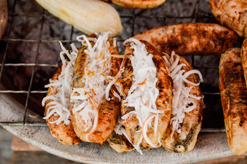 Grilled bananas usually stuffed with young coconut called maak kuai nyad sai, a popular authentic local street food in Luang Prabang, Laos