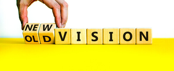 New or old vision symbol. Businessman turns cubes and changes words 'old vision' to 'new vision'....