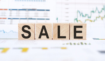 The word sale on wooden cubes on a white background