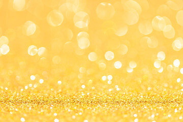 sparkles of yellow glitter abstract background. Copy space