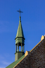 Close-up of a Cross on a Christian church on blue background