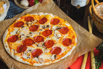 Traditional Italian pizza pepperoni with cheese and mushrooms.