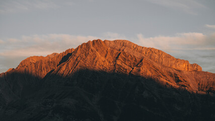 High mountains alpenglow orange color during sunset in the Pyrenees.