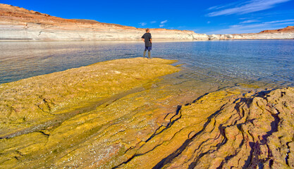 Hiker standing on Rock at Lake Powell AZ