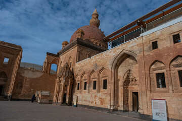 Fototapeta na wymiar Lateral view of main dome of mosque , Ishakpasa (Ishak Pasha) palace with the beatiful sky - Dogubayazit, Turkey