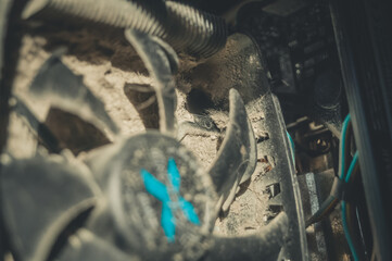 Dusty fan of the cooling system of the computer processor. Dirt on the fins of the radiator....