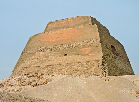 The Meidum  pyramid was Egypt's first straight-sided one. It's located 100 km south of Cairo