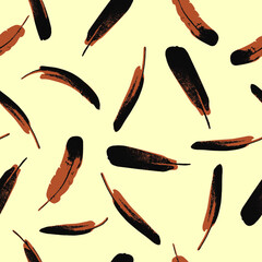 Monochrome vector seamless pattern of brown feathers on yellow background.