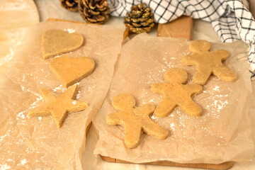 the process of making gingerbread men cookies , christmas cookies