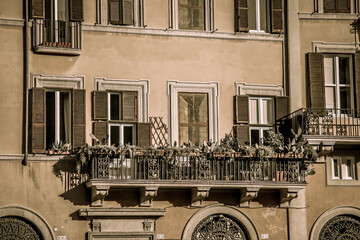 A picturesque old balcony with a painted window on the famous Piazza Navona in Rome