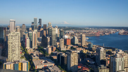 Seattle, Washington, USA - June 4 2021: Seattle downtown skyline and Mount Rainier during summer sunset. View from Seattle needle.