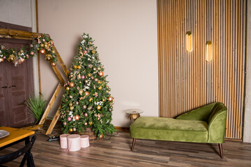 Interior view from living room with a Christmas tree to kitchen and set table served for Christmas or New Year 