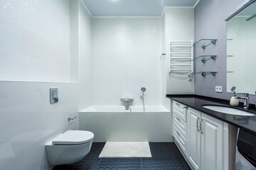 Fototapeta na wymiar Fancy high gloss bathroom with basin cabinet, mirror, toilet, washer
