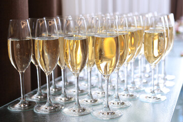 Champagne glasses on the table. Buffet table. A party or celebration. The concept of the holiday.Buffet at a social party.