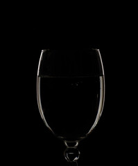 Empty glass on black background