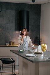 Young cute woman with a smartphone in hands