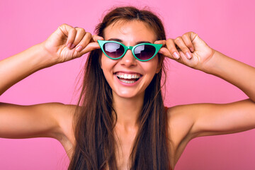 Fototapeta premium Bright studio portrait of pretty brunette young woman