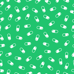Green seamless pattern with white pills