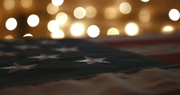 cinematic camera flyby near american flag with luxurious and beautiful bokeh in the background